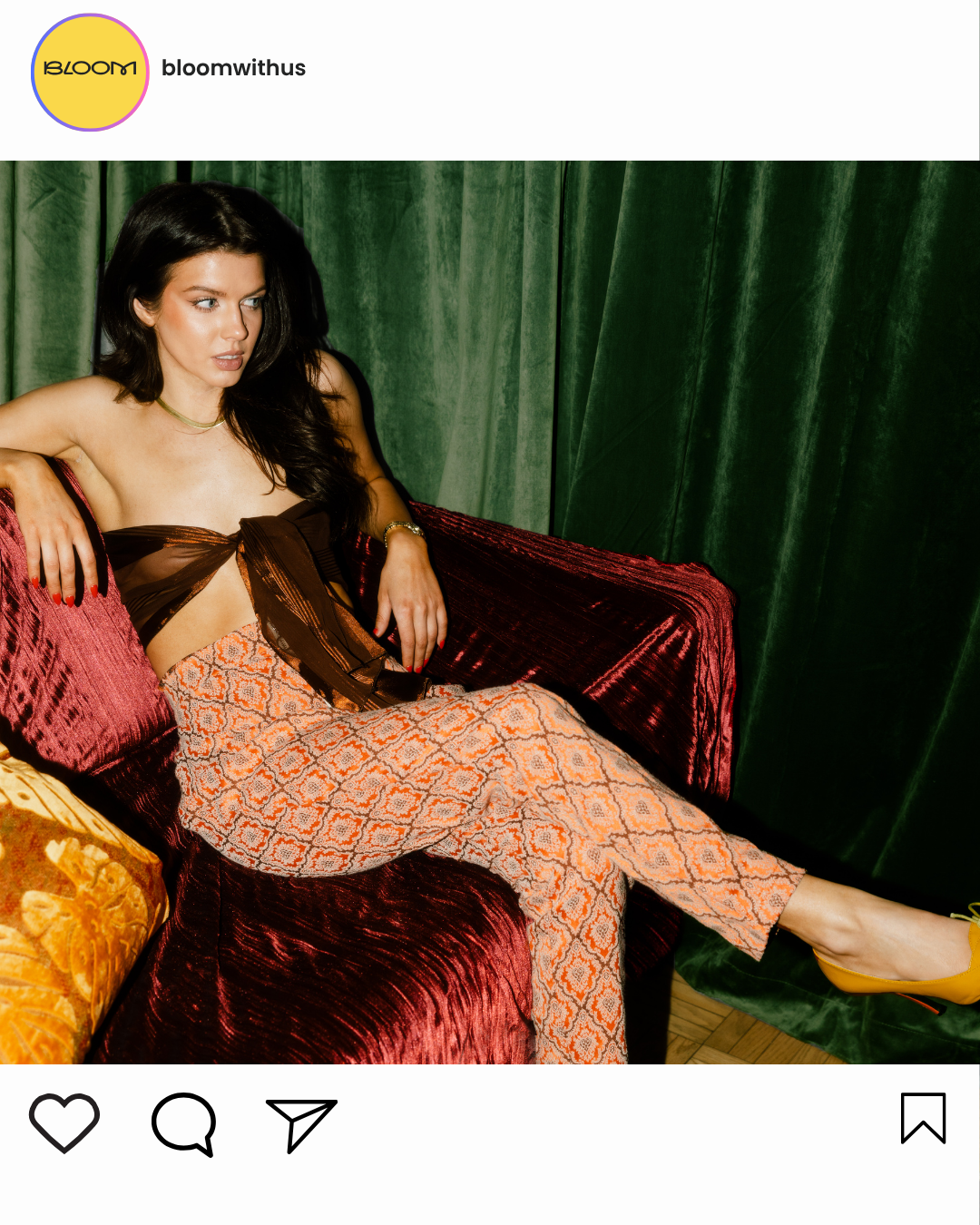 Woman lounging on red sofa